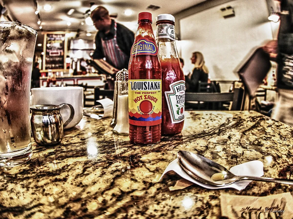 Bottles of hot sauce and ketchup on a restaurant table in New Orleans