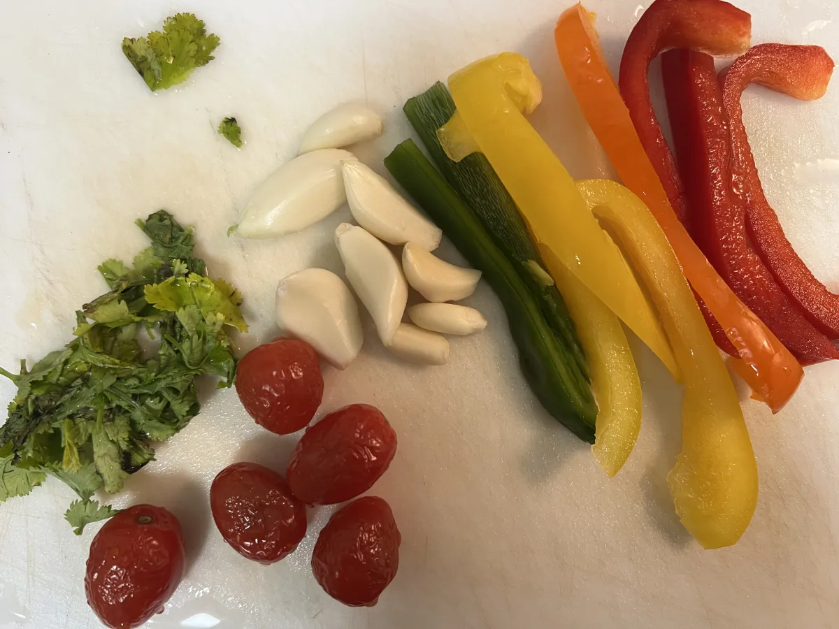 Slicing and Preparing Fresh Tomatoes on a Cutting Board