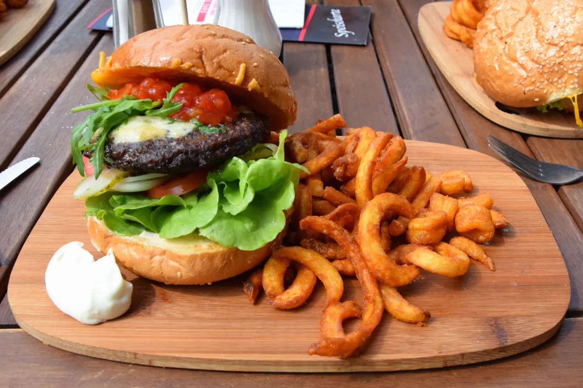 A fast food meal of burger and fries begging for condiment packets