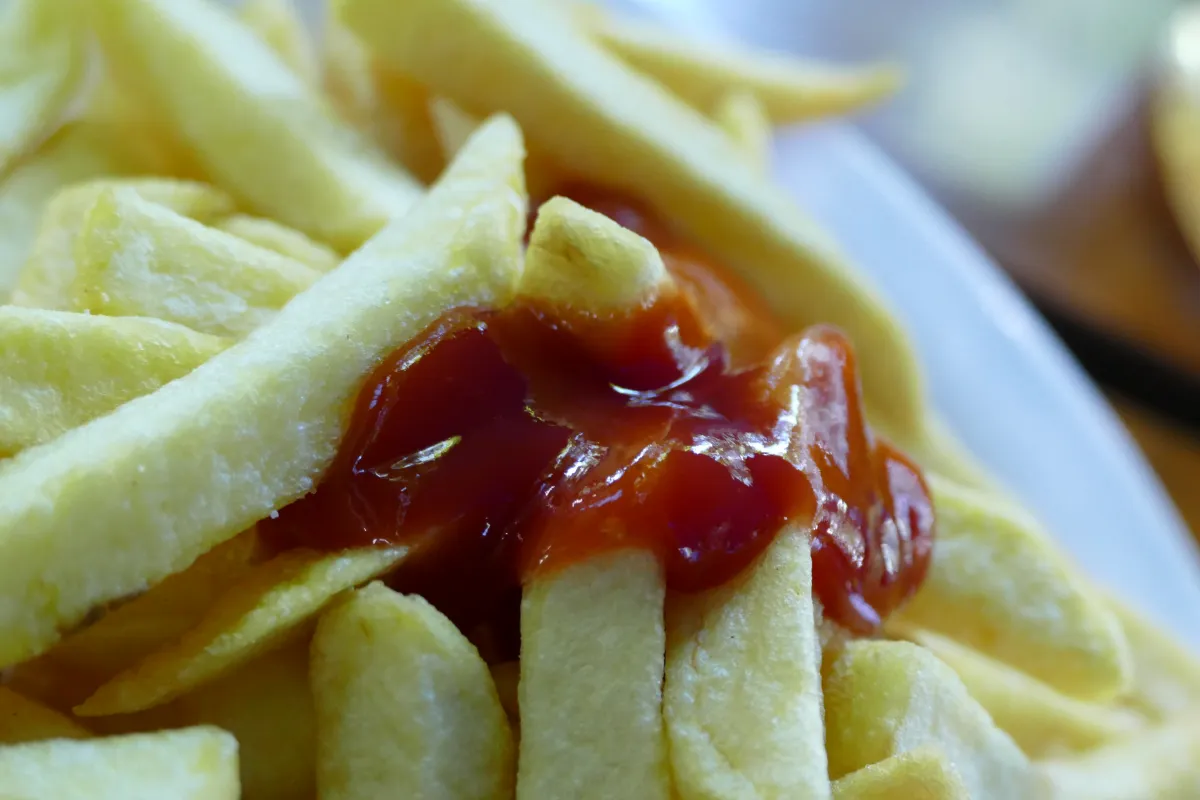 Crispy french fries with a side of ketchup