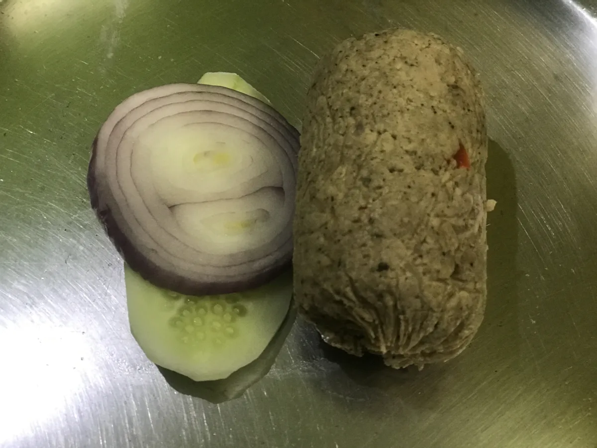 Homemade Meatloaf Being Glazed with Ketchup Before Baking