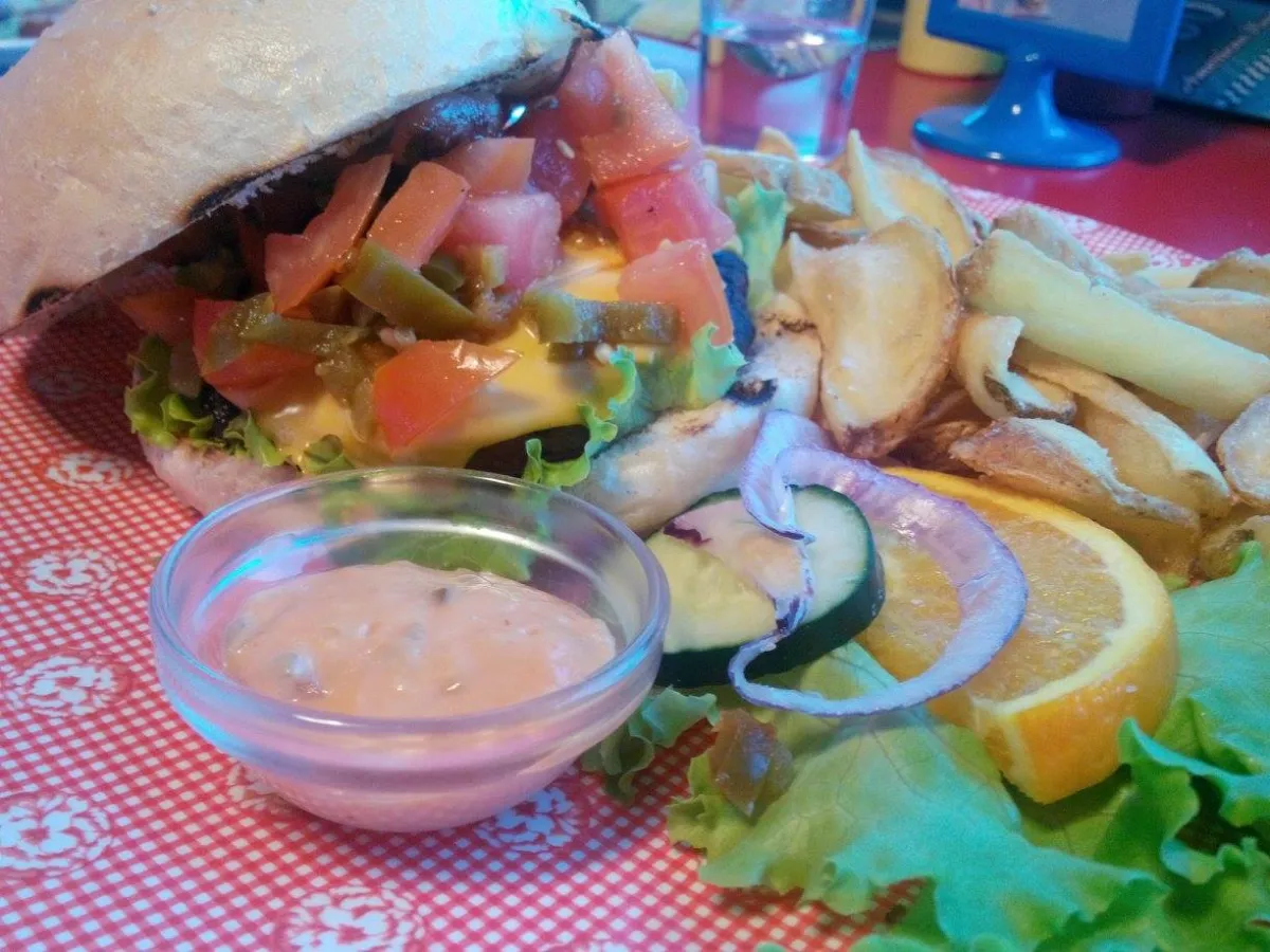 A hamburger with golden fries, a staple of American food culture
