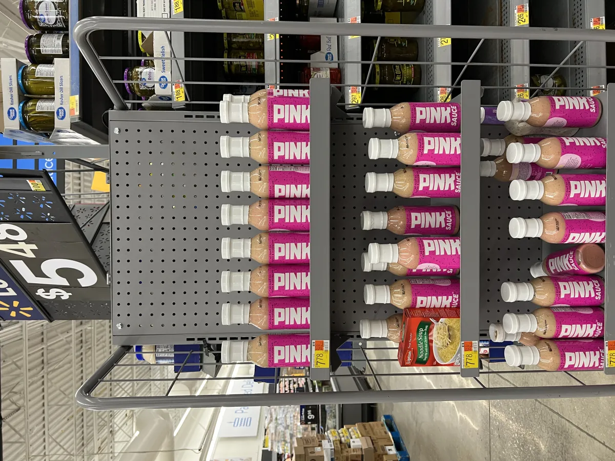 A premium sauce product on retail shelves