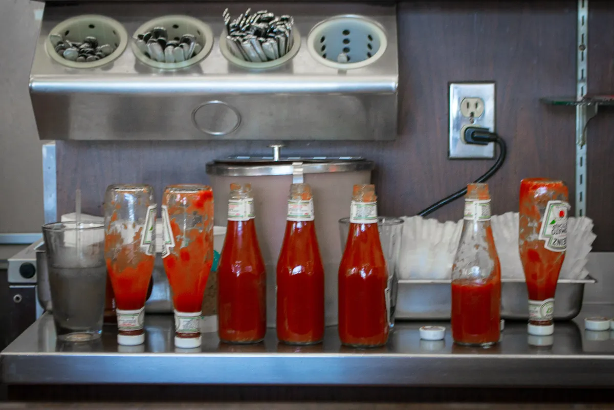 Ketchup bottles stocked and ready at a busy diner