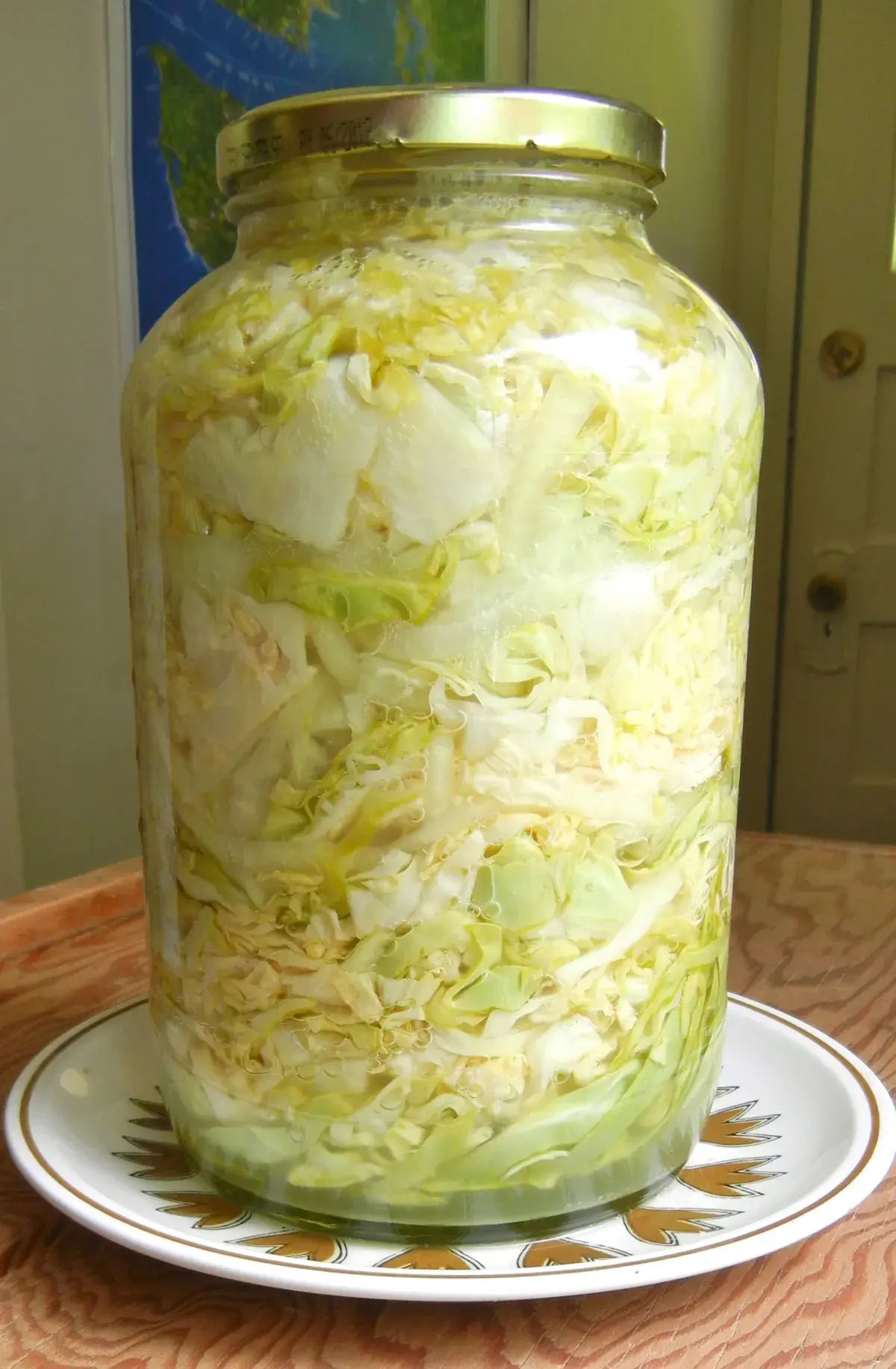 Sauerkraut Fermenting in a Glass Jar with Visible Bubbles