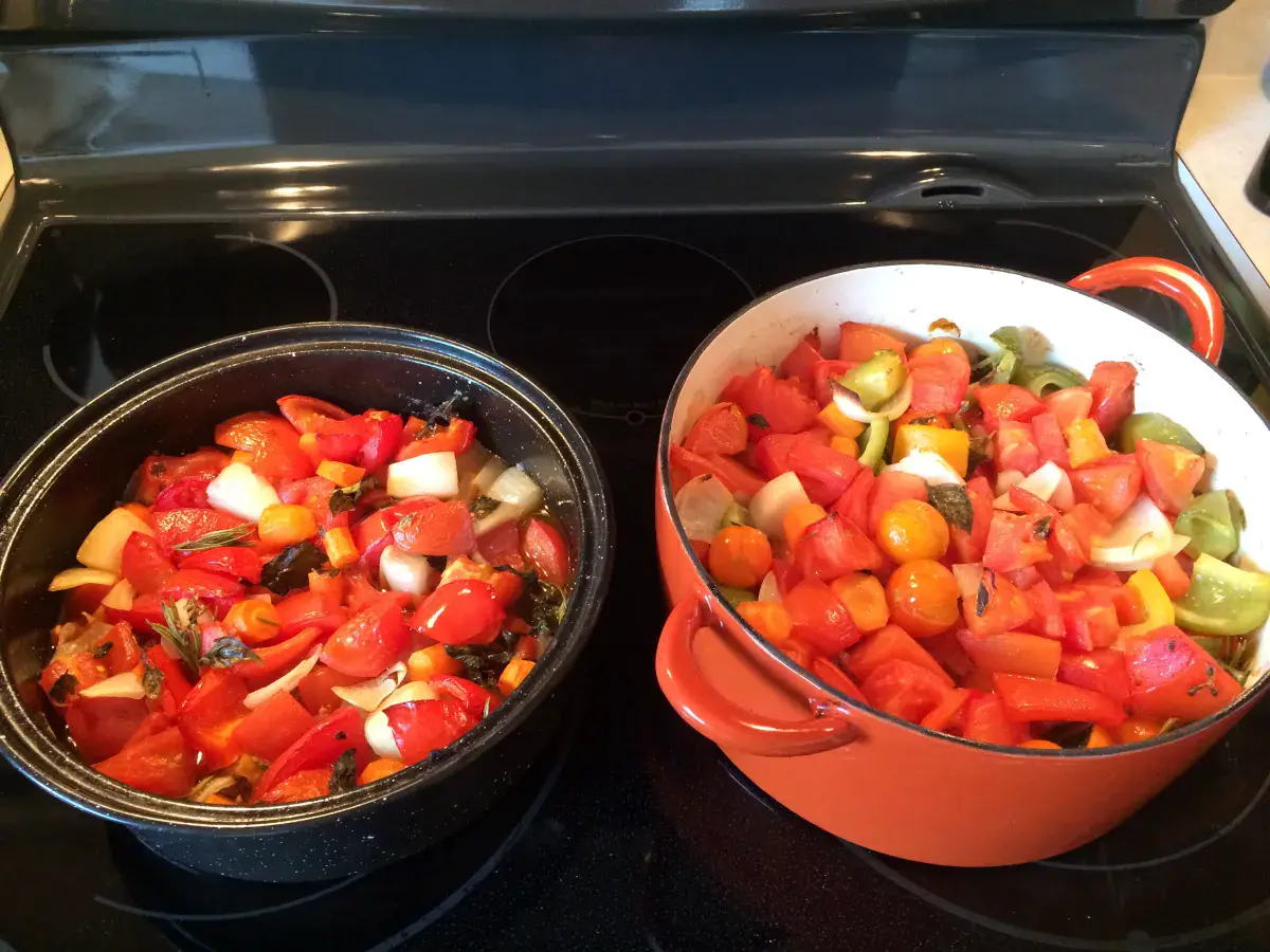 Fresh tomatoes and spices laid out for sauce making