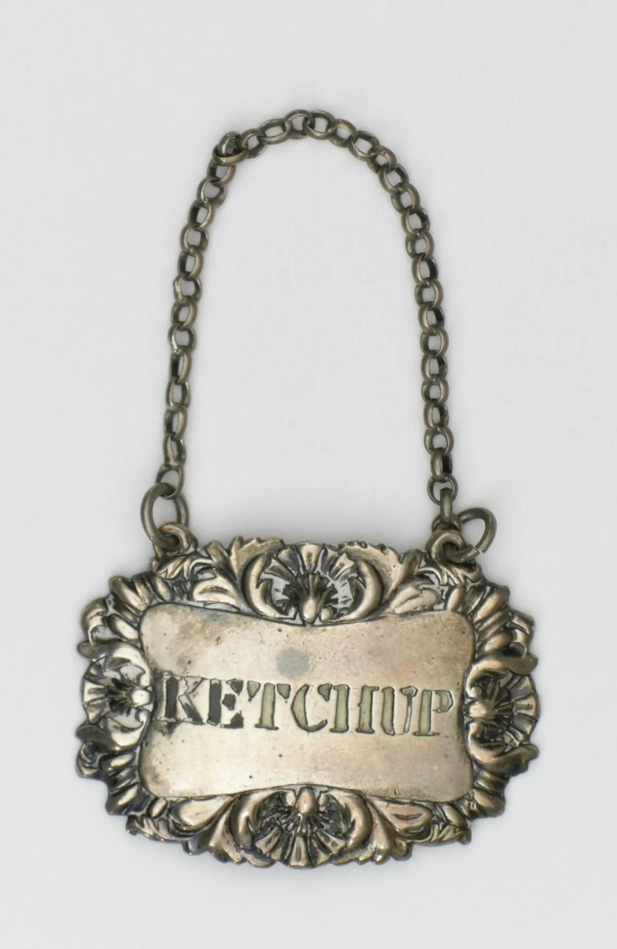 Vintage silver ketchup bottle ticket from London circa 1800 showing the long history of the word ketchup
